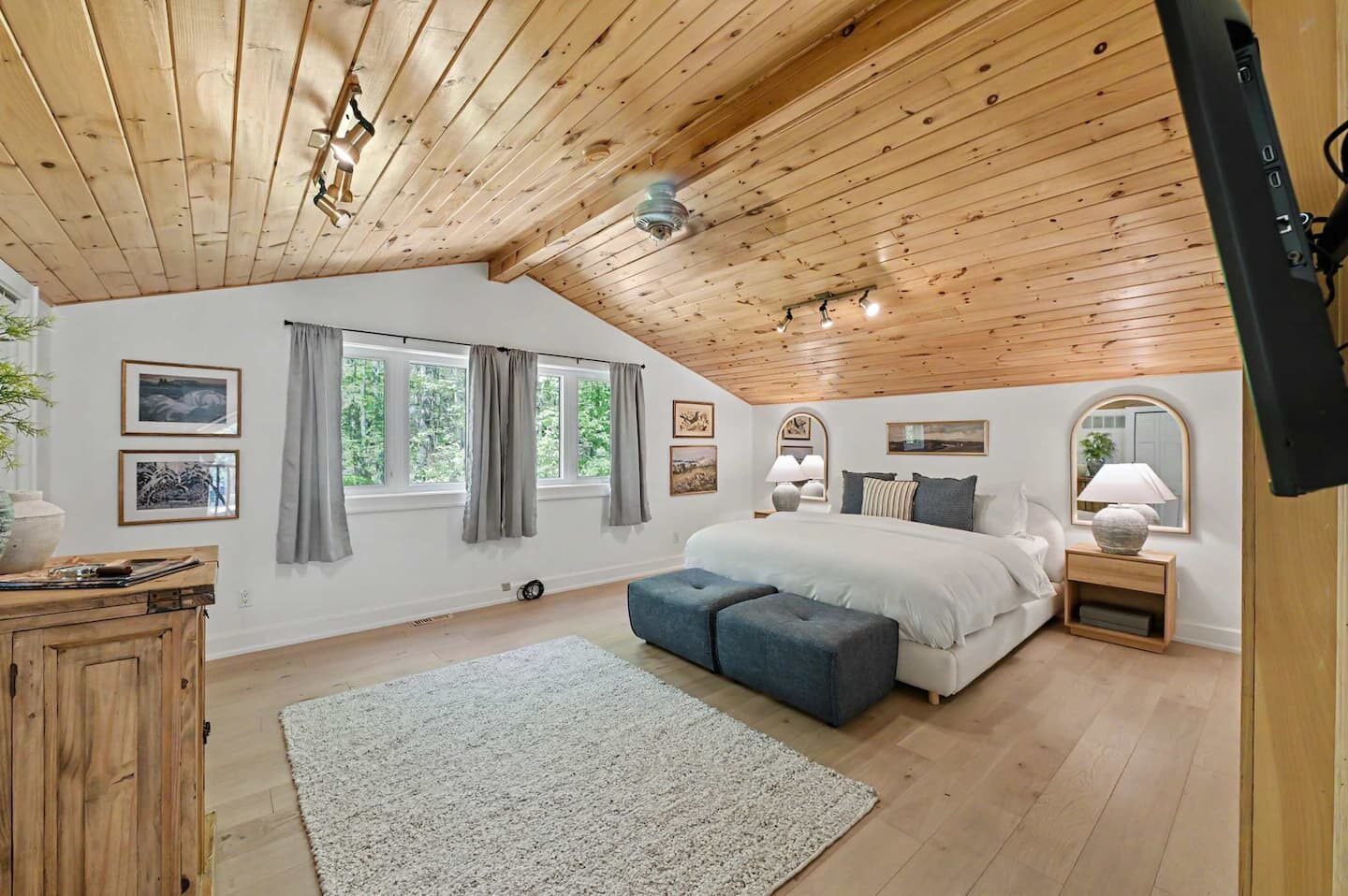 Loft king bedroom with vaulted ceiling