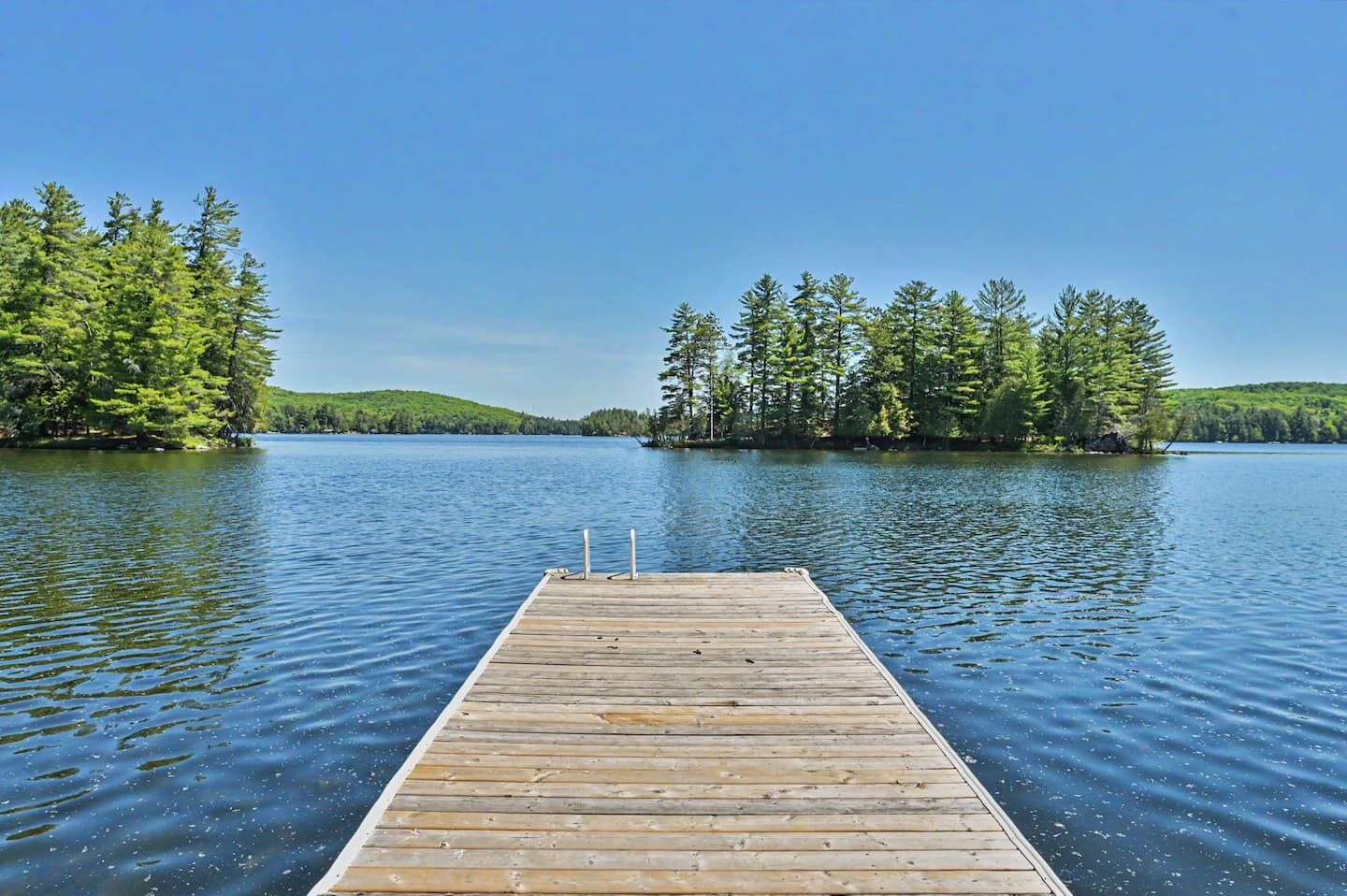 Private dock reaching into the clear waters of Lake of Bays